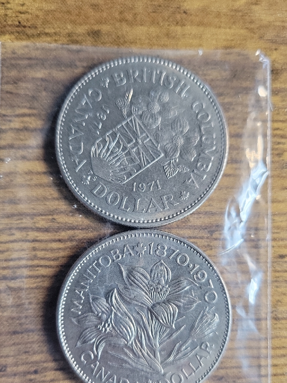 Two (2) 1970/71 Canada British Columbia & Manitoba Commemorative Silver Dollars